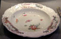 Painted porcelain plate in Meissen style from Chelsea, England at National Museum of Scotland. Edinburgh, Scotland.