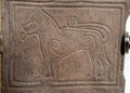 Symbolic Pictish animal with coiled design elements on Papil cross at National Museum of Scotland. Edinburgh, Scotland.