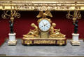 French drum mantle clock topped by eagle with torches & flanked by man & woman reading plus two candelabras at National Gallery of Scotland. Edinburgh, Scotland.