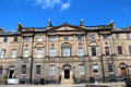 Row of Georgian-style classical houses along north side of Charlotte Square built by individuals to unified symmetrical design. Edinburgh, Scotland.