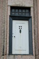 Charles Rennie Mackintosh-designed front door moved from demolished Mackintosh house nearby to Hunterian Art Gallery to display the original Mackintosh-designed furniture & woodwork interiors. Glasgow, Scotland.