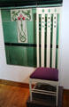 House for an Art Lover music room high-back chair by Charles Rennie Mackintosh at The Lighthouse. Glasgow, Scotland.