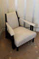 Upholstered easy chair by C.R. Mackintosh in drawing room at Hill House. Helensburgh, Scotland.