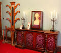 Hat & umbrella stand beside sideboard with candlesticks in parlor at Holmwood. Glasgow, Scotland.