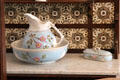 Tiled washstand with pitcher & basin in Reid farmhouse at National Museum of Rural Life. Kittochside, Scotland.