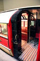 Subway carriage from when all stations had central platforms so doors were only on one side & other side of train was unpainted at Riverside Museum. Glasgow, Scotland.