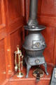 Pot-bellied stove in poop cabin of Glenlee Tall Ship. Glasgow, Scotland.