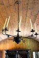 Wrought iron chandelier hanging from barrel vaulted pine ceiling in High Hall at Culross Palace. Culross, Scotland.