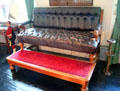 Elevated leather sofa for watching billiards in billiard room / library at Glamis Castle. Angus, Scotland.