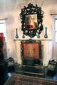 Fireplace with carved mirror & screen in king's bedroom at Glamis Castle. Angus, Scotland.
