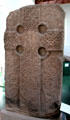 Pictish cross-slab with complete circles at joins of the cross plus lacework of animals in oldest style of Picts at Meigle Sculptured Stone Museum. Meigle, Scotland.