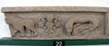 Pictish architectural frieze with two clawed beasts flanking half-woman / half-fish siren at Meigle Sculptured Stone Museum. Meigle, Scotland.
