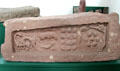 Pictish graveslab with entwined beasts, a bear & hound, 12 bosses & 7 bosses circled by serpents at Meigle Sculptured Stone Museum. Meigle, Scotland.
