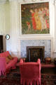 Procession of Girls painting by Phoebe Anna Traquair over fireplace surrounded by Delft tiles in drawing room at Kellie Castle. Pittenweem, Scotland.