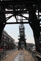 Visitors on walkway between Floating Harbour & row of warehouses. Bristol, England.