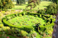 Hedge enclosed garden with topiary display at Chastleton House. Moreton-in-Marsh, England