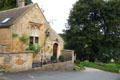 "The Old School House" with bell for calling students to class. Upper Slaughter, England