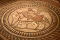 Scene from Seasons Mosaic, depicting Silenus, guardian of Bacchus, riding a donkey, at Corinium Museum. Cirencester, England
