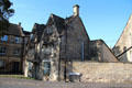 Vintage stone building with steep gables on High Street. Northleach, England.