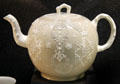 Light brown punch pot with applied molded white relief decoration made in North Straffordshire at Potteries Museum & Art Gallery. Hanley, Stoke-on-Trent, England