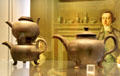 Black earthenware teapots with two stacked spoiled versions excavated locally at World of Wedgwood. Barlaston, Stoke, England.