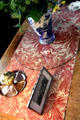 Tulip cloth table runner by William Morris for Morris & Co in drawing room at Wightwick Manor. Wolverhampton, England.