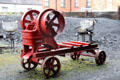 Stone crusher machine run by belt from steam engine made by Frederick Parker Viaduct Works of Leicester at Ulster Folk Park. Belfast, Northern Ireland.