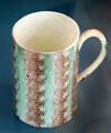 Creamware mug by Downshire Pottery of Belfast at Ulster Museum. Belfast, Northern Ireland.