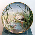 Earthenware heron painted wall plaque by Belleek at Ulster Museum. Belfast, Northern Ireland.