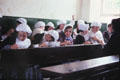 School children learning how classes were held in times past at Ulster Folk & Transport Museum. Northern Ireland.