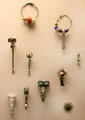 Celtic culture brooches & pins of bronze with beads from England & France at British Museum. London, United Kingdom.
