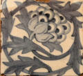 Artichoke ceramic tile by William Morris or William De Morgan at Morris Gallery. London, United Kingdom