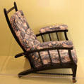 Armchair with back adjustable to recline to several angles which became widely copied with generic name Morris Chair by Philip Webb for Morris & Co at Morris Gallery. London, United Kingdom