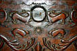 Carved oak chest front with rabbits & dogs at La Purisima Mission. Lompoc, CA.