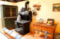 Coal burning cook stove beside baking table with built-in flour bins at Red Barn Museum. San Andreas, CA.