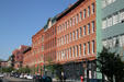 Streetscape of heritage buildings along Wazee Street from 16th St. Mall. Denver, CO.