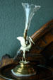 Silver crane holding vase at Byers-Evans House. Denver, CO.