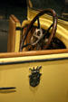 Steering wheel & door crest of Hispano Suiza Victoria Town Car at Forney Museum. Denver, CO.