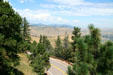 Road to top of Lookout Mountain with mountains in distance. CO.