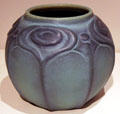 Pottery bowl with peacock feathers by Artus Van Briggle at Colorado Springs Fine Arts Center. Colorado Springs, CO.
