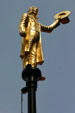 Man with top hat, one of series of gilded statues on poles surrounding Old State House. Hartford, CT.