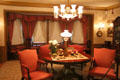 Drawing room table & chairs with lamps & collections at Hill-Stead Museum. Farmington, CT.