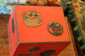 Japanese red lacquer lunch box decorated with Samurai sword guards at Hill-Stead Museum. Farmington, CT.