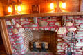 Fireplace with mantle lamps at Gillette Castle State Park. East Haddam, CT.