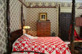 Bed in Art Colony bedroom where guests lived a Bohemian life at Florence Griswold Museum. Old Lyme, CT.