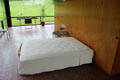 Bed & wooden armoire wall at Philip Johnson Glass House. New Canaan, CT.