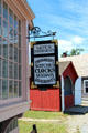 Nautical instruments & clockmaker's sign at Mystic Seaport. Mystic, CT.