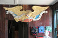 Eagle with shield shipboard in Shipcarver's Shop at Mystic Seaport. Mystic, CT.