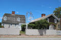 Streetscape with ship masts at Mystic Seaport. Mystic, CT.