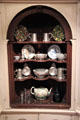 Cabinet with collection of pewter & ceramic vessels at Yale University Art Gallery. New Haven, CT.